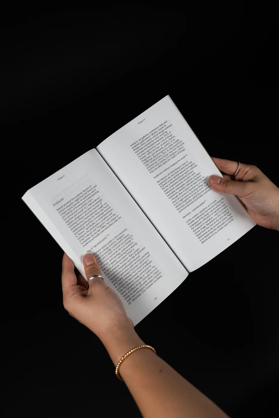 The perfect-bound book held open to a spread of text