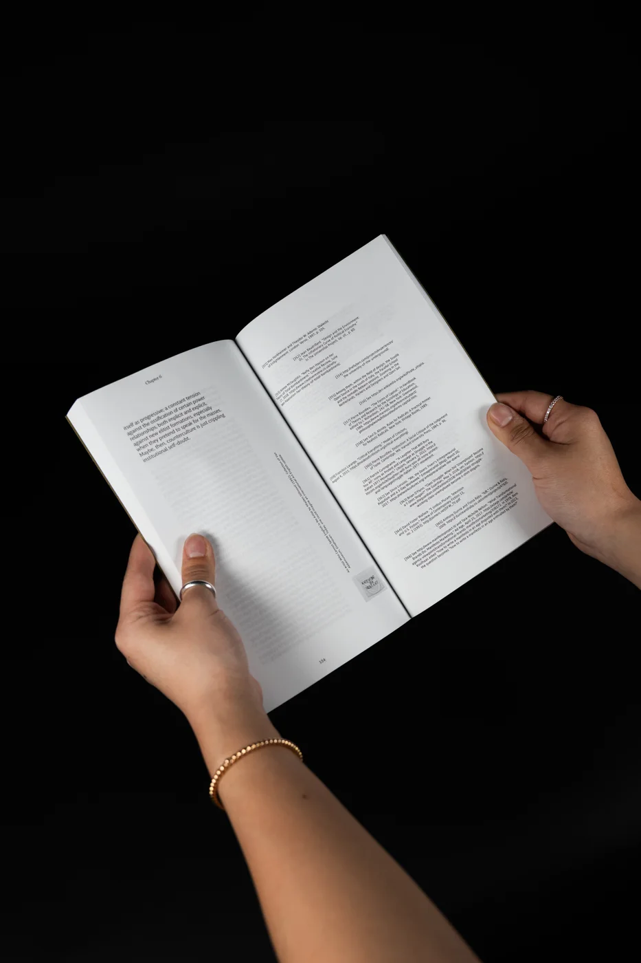 An open spread with a column of annotations running beside the text