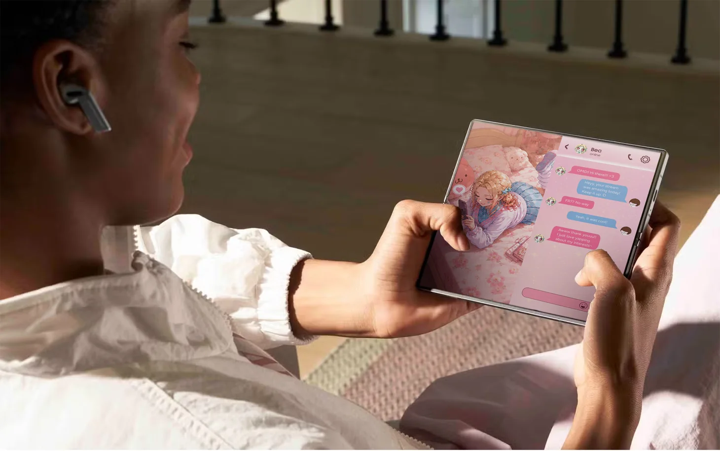 Hands holding an unfolded Galaxy Fold showing the simulator app
