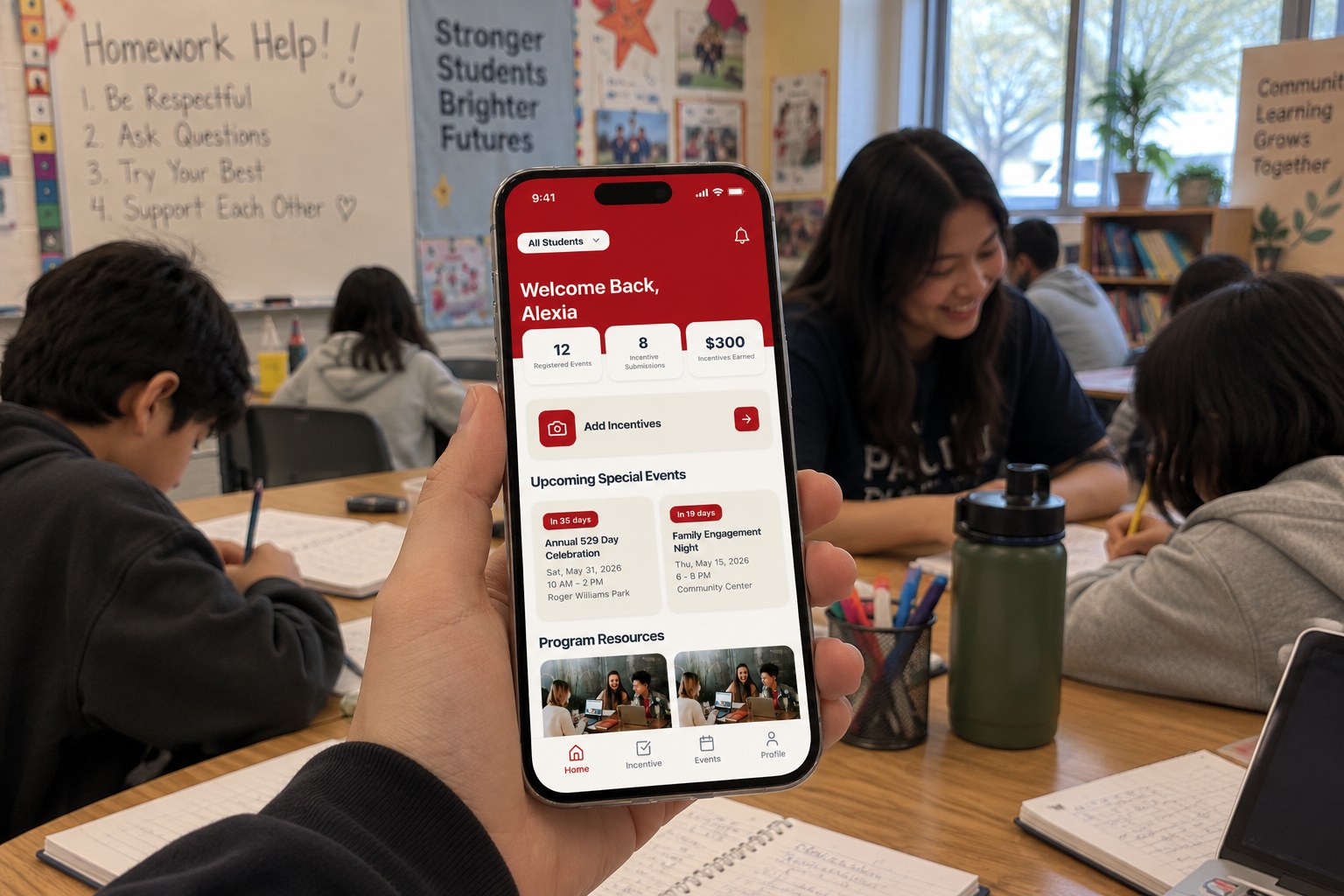 In a community classroom, a hand holds a phone open to the Providence Promise app home screen: Welcome Back, Alexia, with events, submissions, and $300 earned